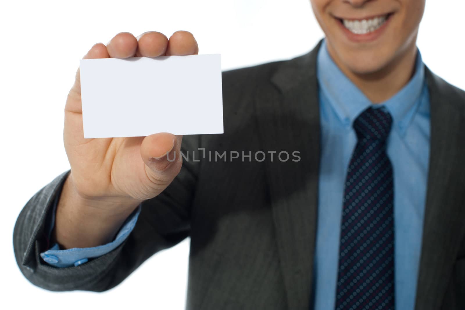 Businessman showing his card by stockyimages