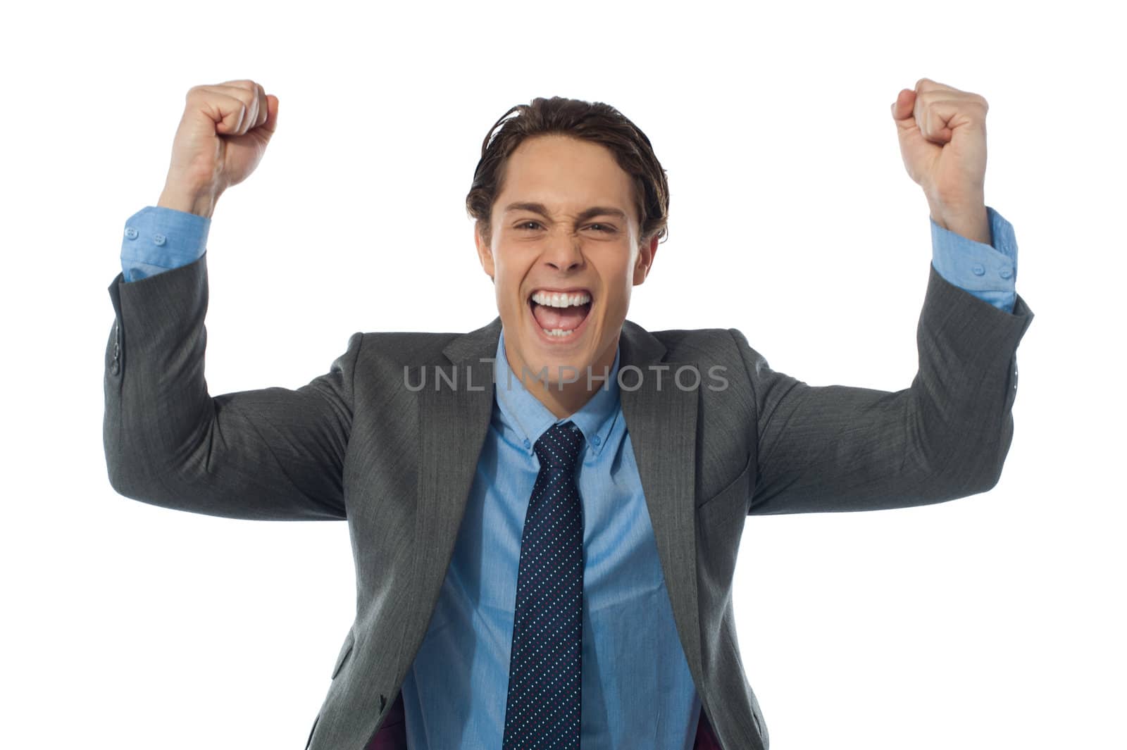 Excited businessman rasing his arms and cheering joyfully. Isolated on white