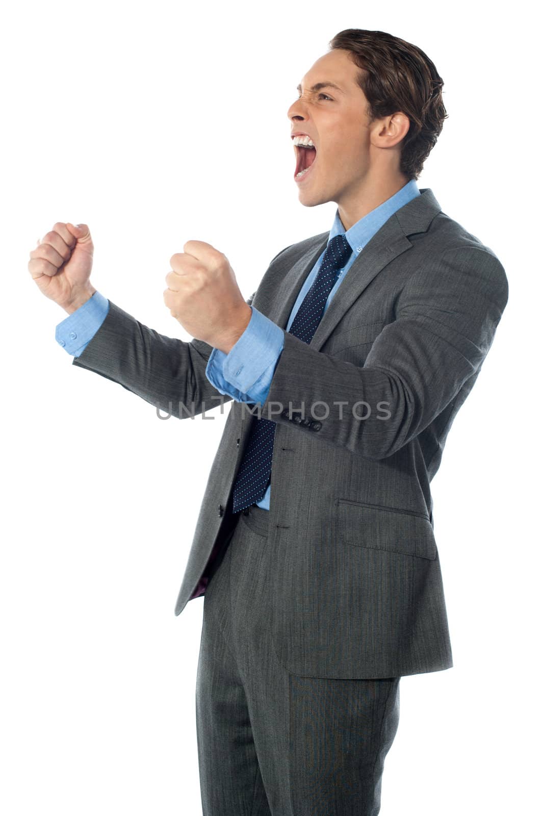 Portrait of an excited businessman by stockyimages