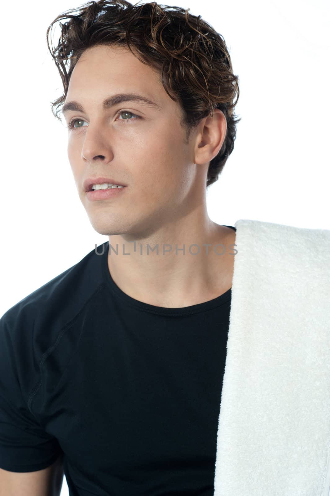 Young handsome guy with towel, closeup shot. Isolated on white