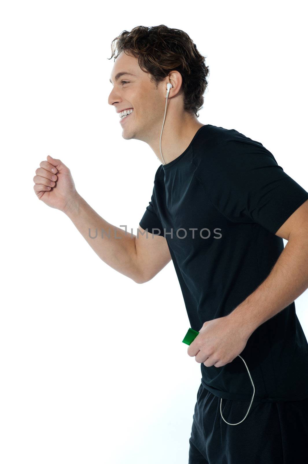 Handsome sports person enjoying music by stockyimages
