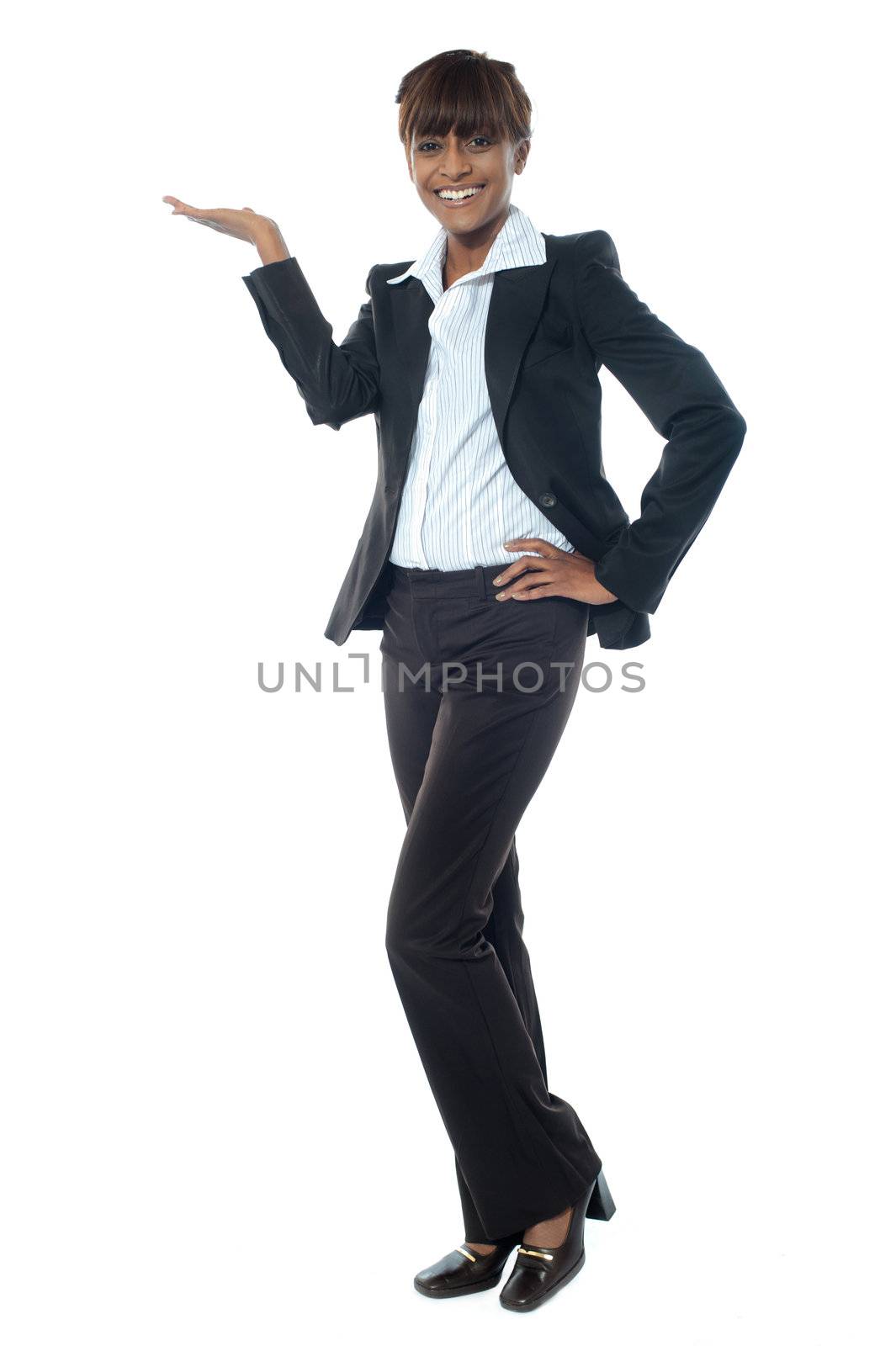 Full shot of female executive posing with copyspace isolated over white background