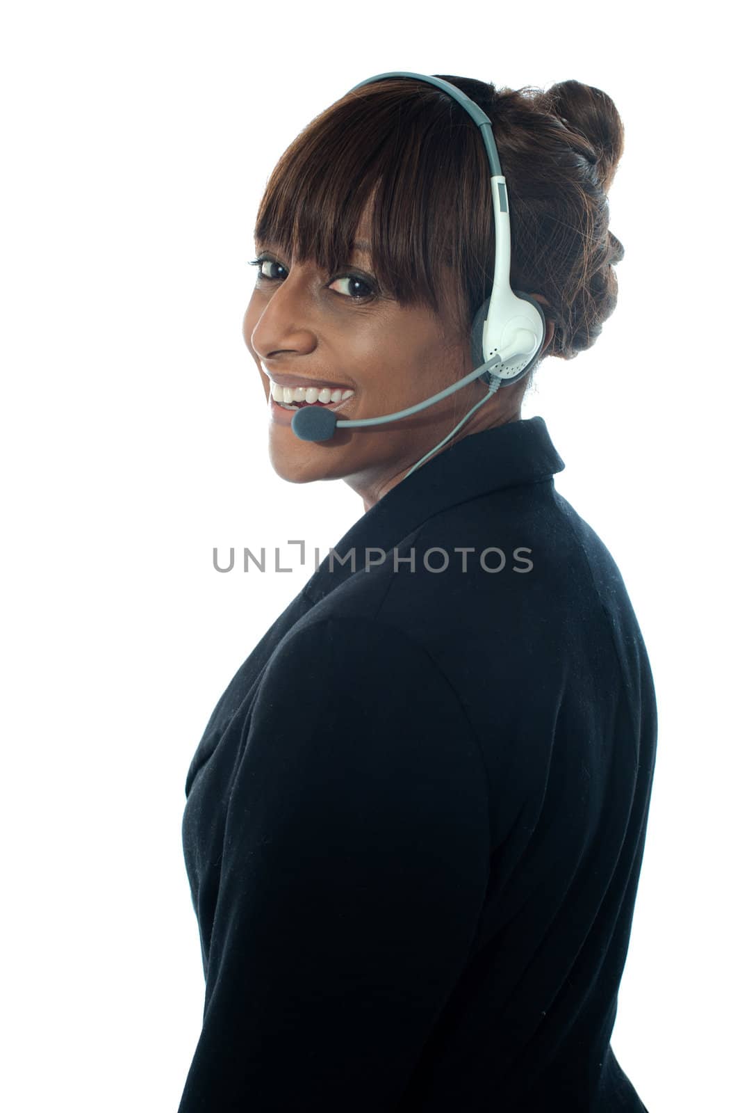 Portrait of executive female in headsets by stockyimages
