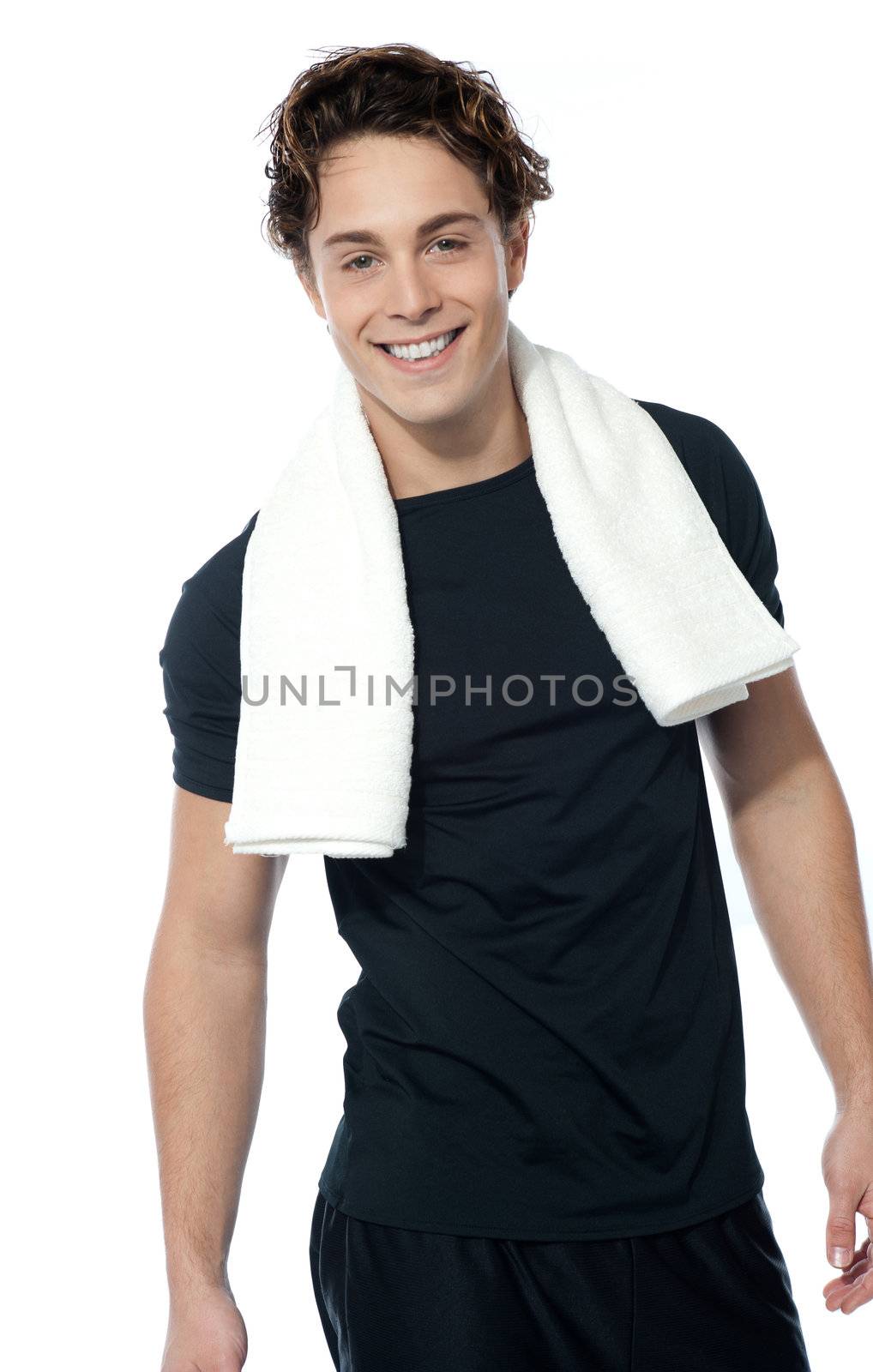 Handsome muscular man with towel around his neck over white background
