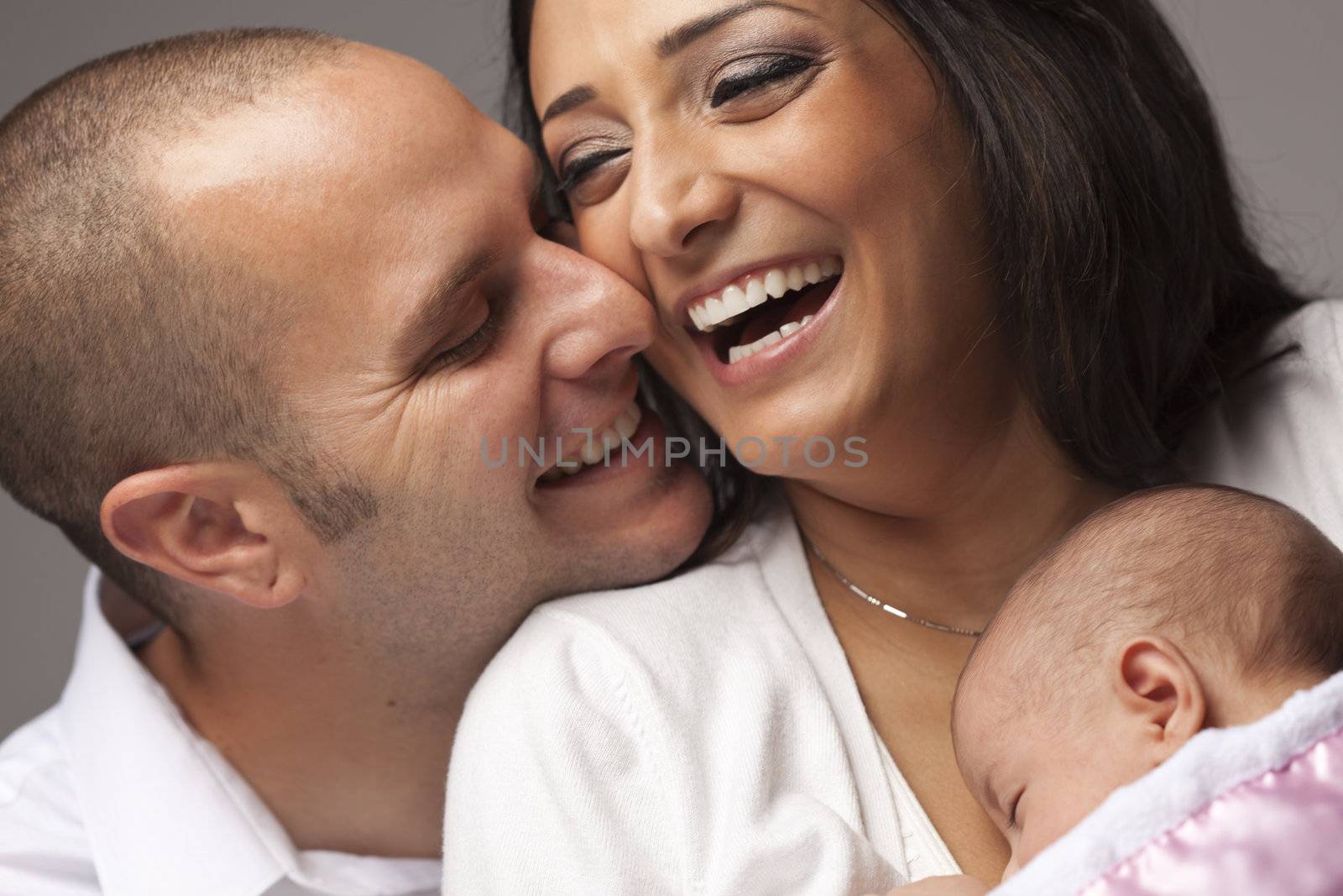 Happy Young Attractive Mixed Race Family with Newborn Baby.