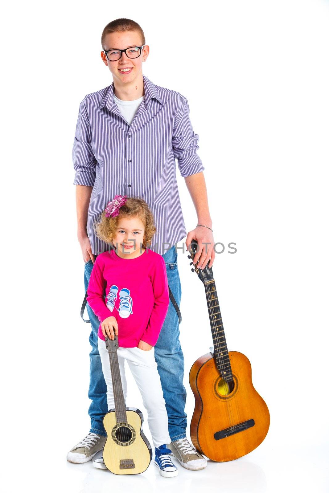 Cute boy and his sister with classical guitars. Isolated on white background