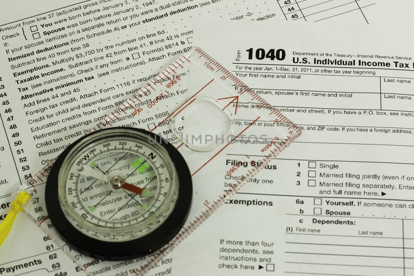 tax form with a compass, guidance concept