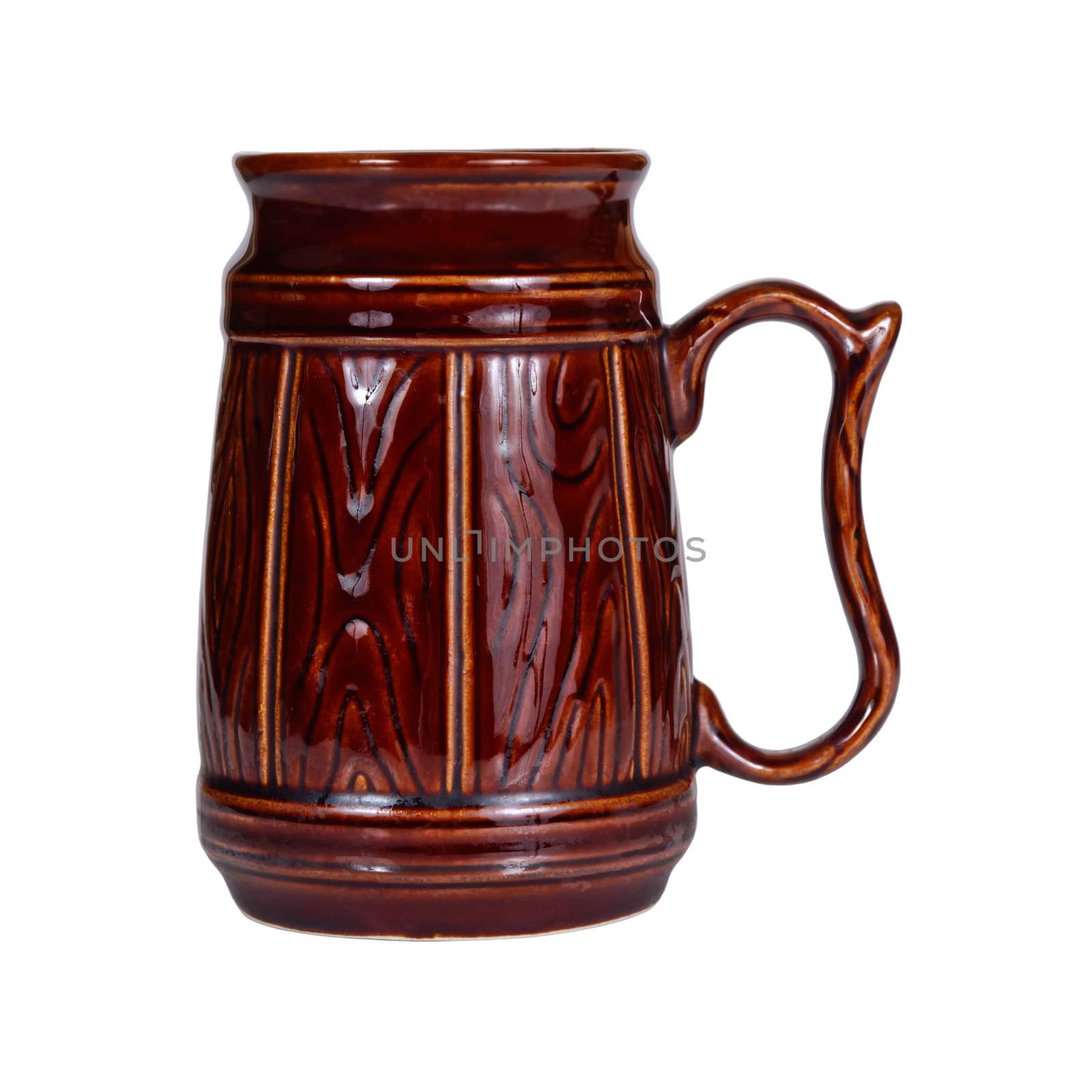 Big traditional brown ceramic mug for beer isolated on white background