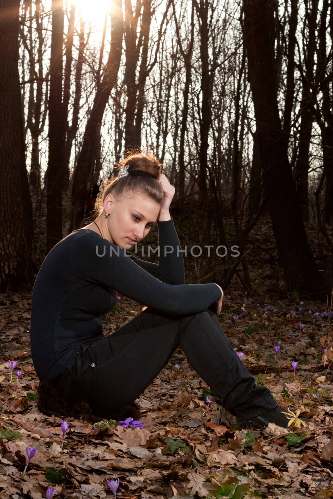 beautiful girl on the background of the spring forest