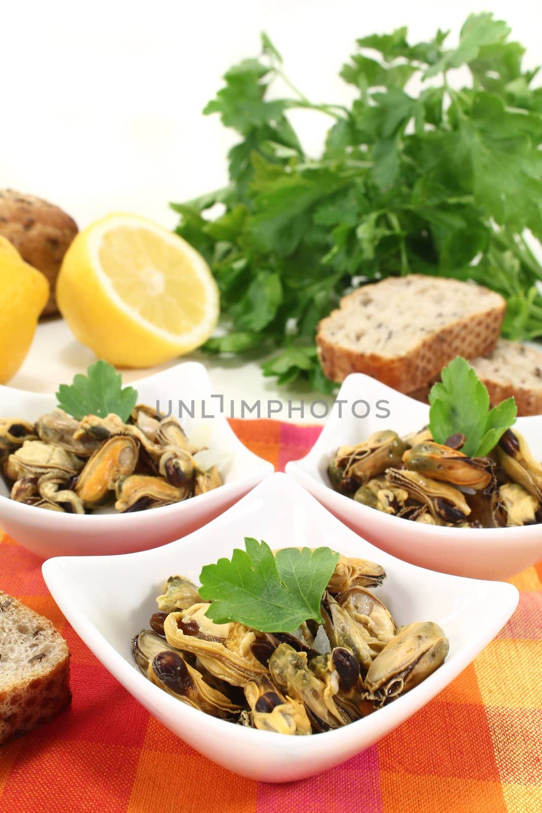 a bowl of marinated mussels and parsley
