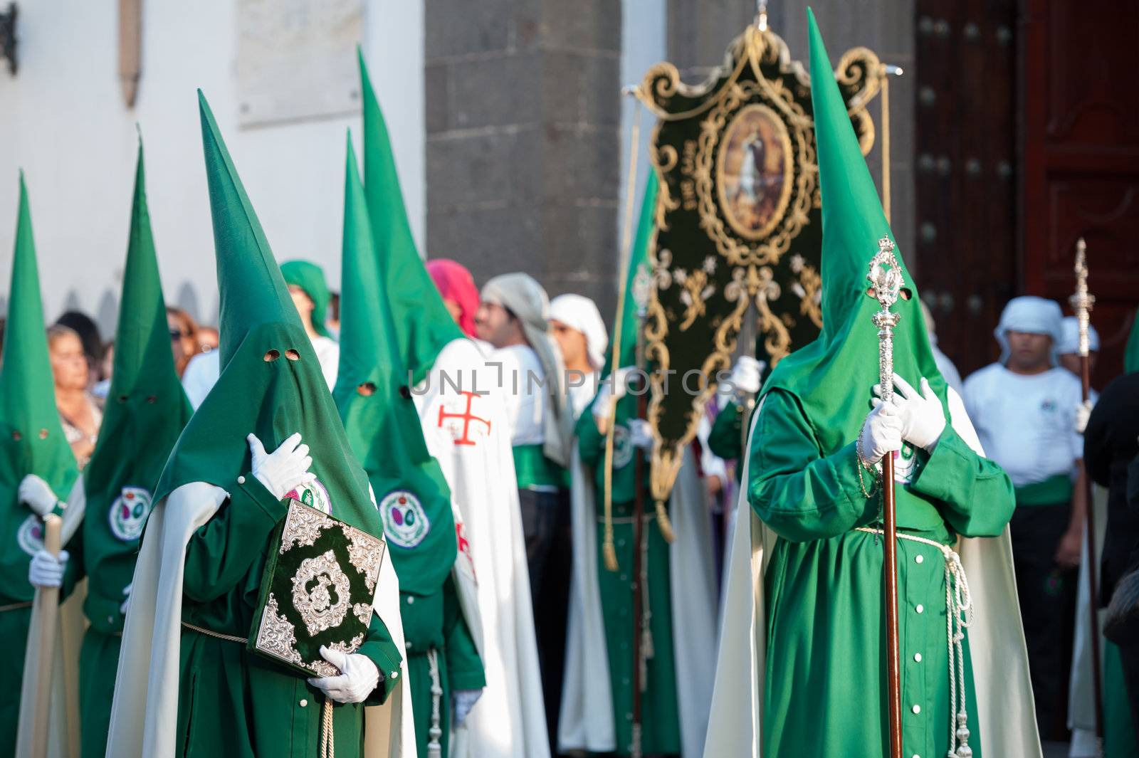 LAS PALMAS, SPAIN–APRIL 2: Unidentified persons, from Canary Islands, wearing hoods (capirotes) and cloaks, during Holy Week marching procession on April 2, 2012 in Las Palmas, Spain
