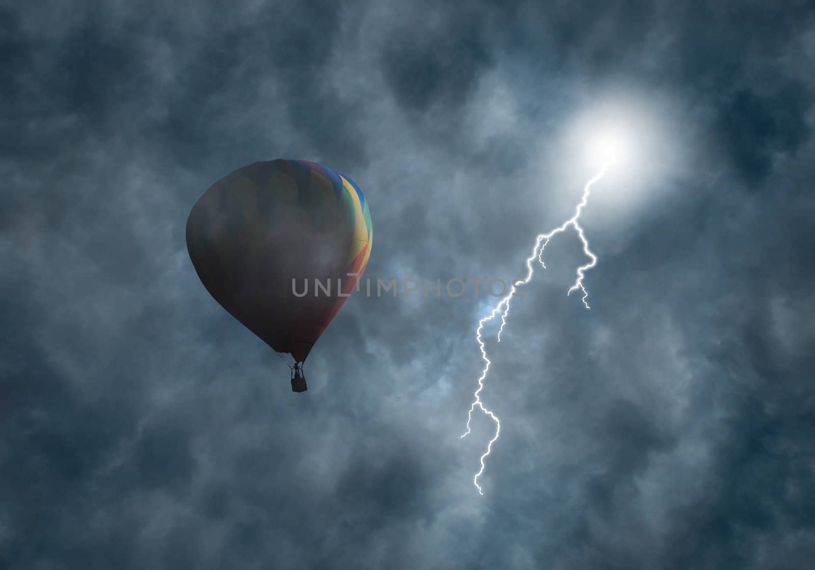 Lightning bolt coming from dark storm clouds toward hot-air balloon