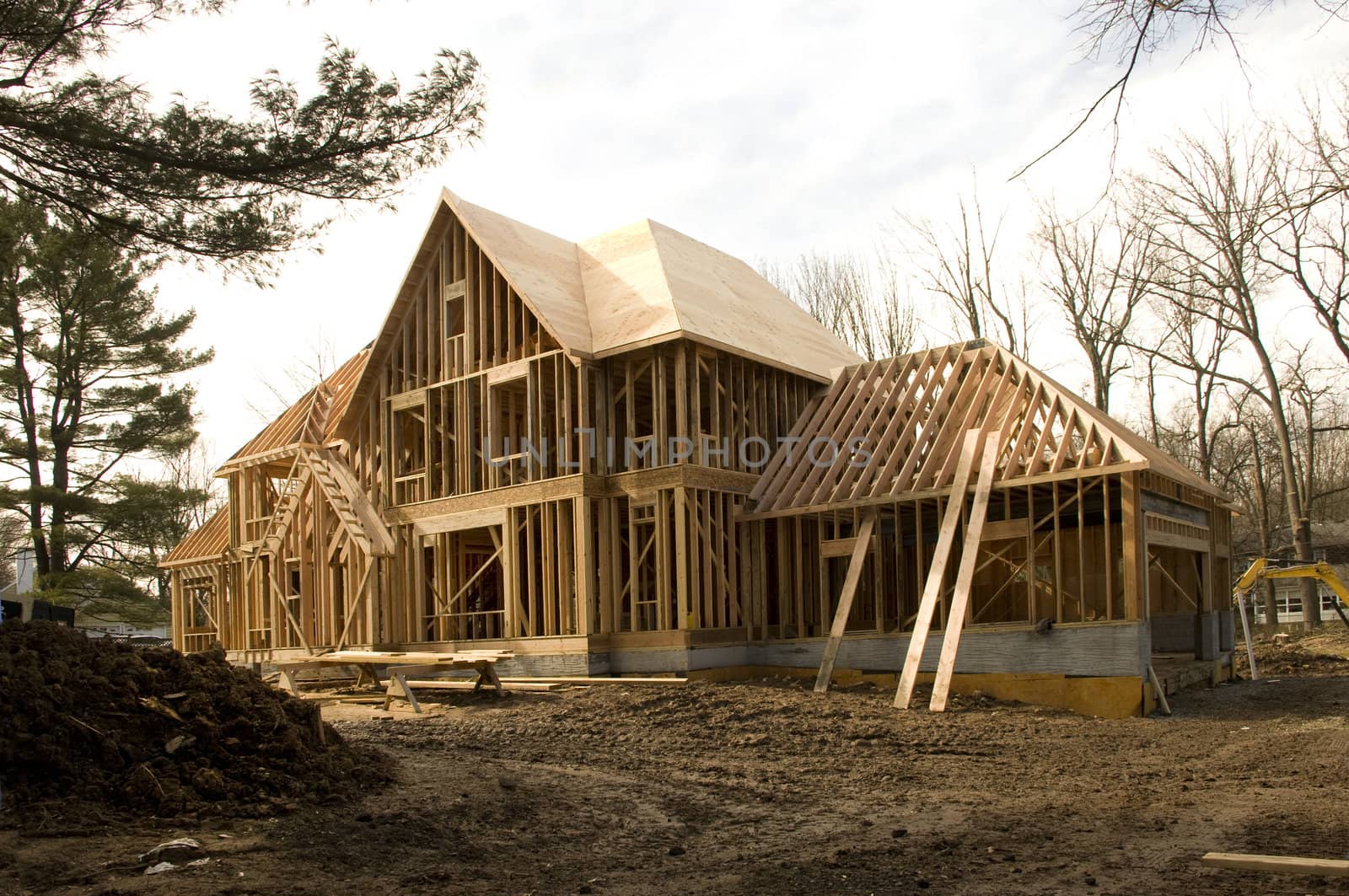 Large McMansion type house under construction in framing phase