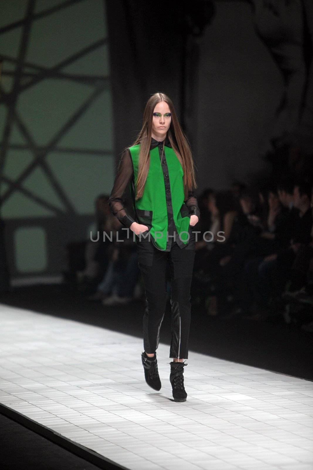 ZAGREB, CROATIA - MARCH 16: Fashion model wears clothes made by Ana Maria Ricov on "Dove FASHION.HR" show on March 16, 2012 in Zagreb, Croatia.
