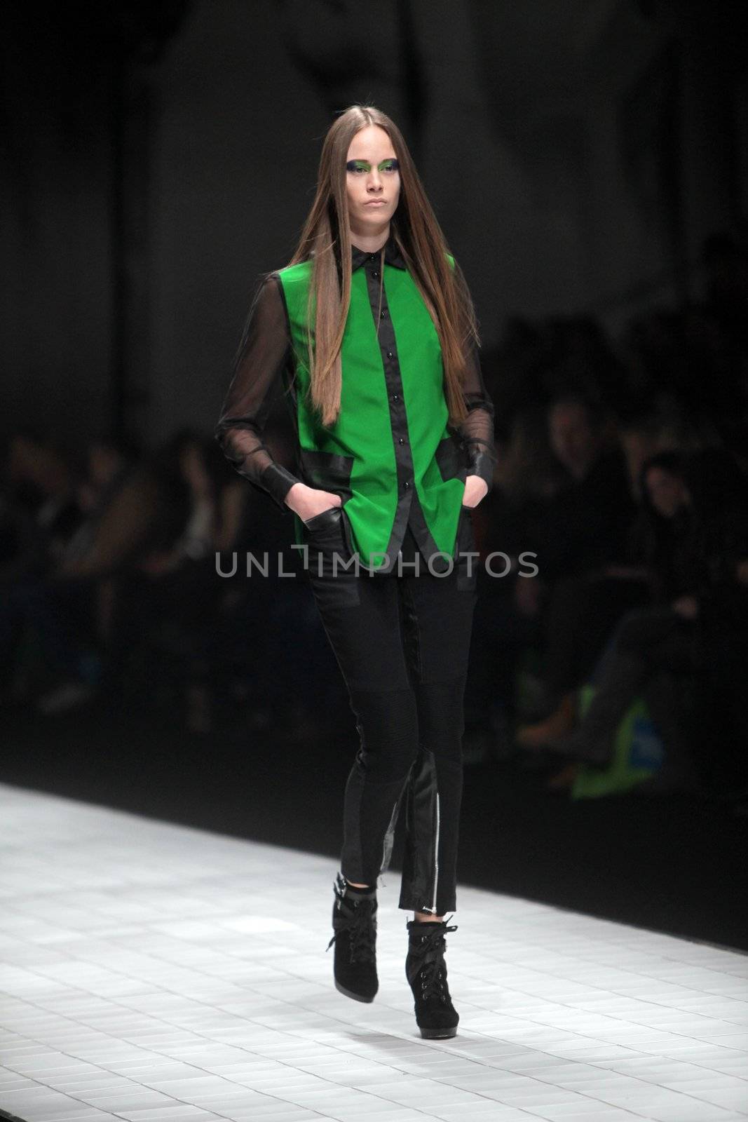 ZAGREB, CROATIA - MARCH 16: Fashion model wears clothes made by Ana Maria Ricov on "Dove FASHION.HR" show on March 16, 2012 in Zagreb, Croatia.