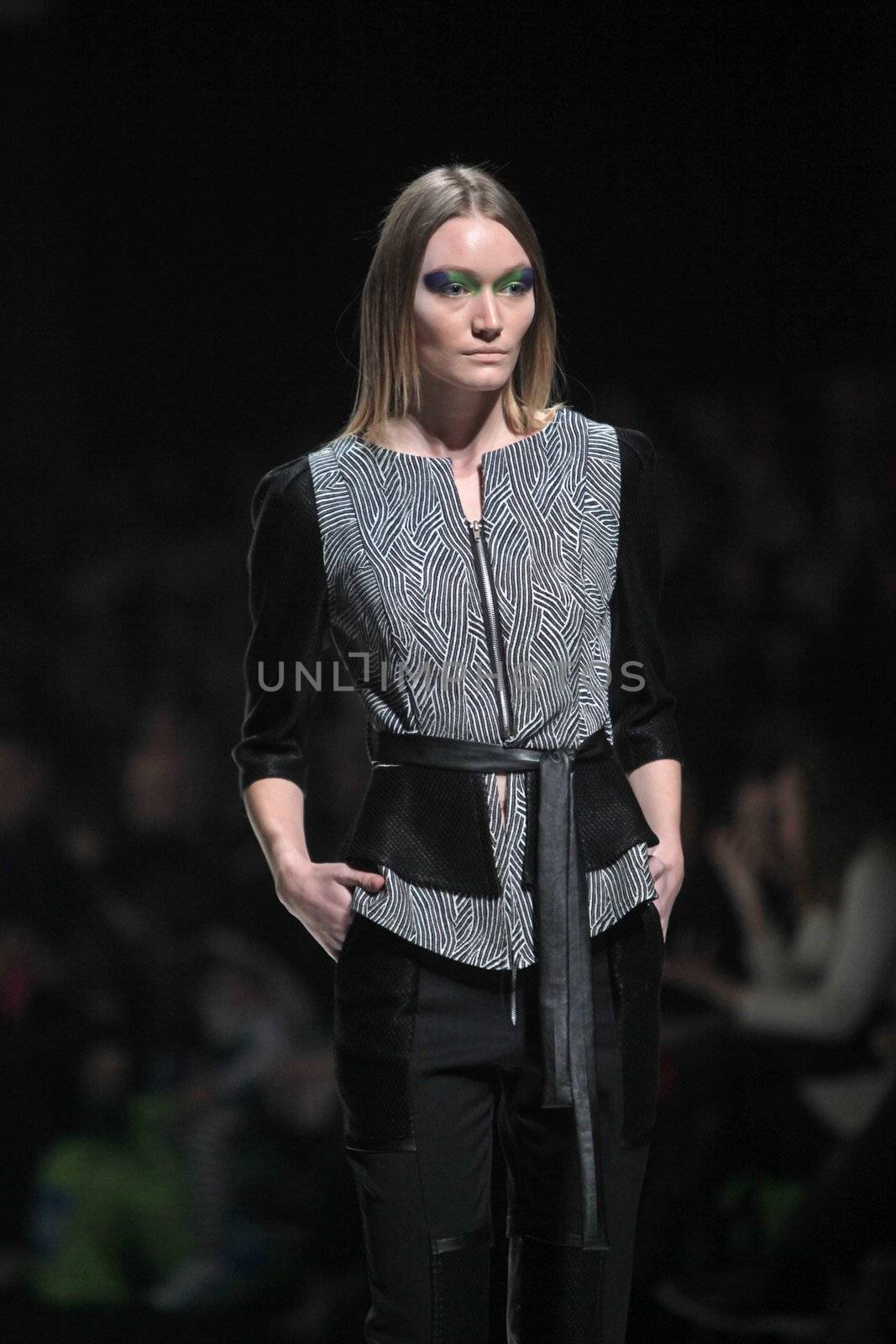 ZAGREB, CROATIA - MARCH 16: Fashion model wears clothes made by Ana Maria Ricov on "Dove FASHION.HR" show on March 16, 2012 in Zagreb, Croatia.