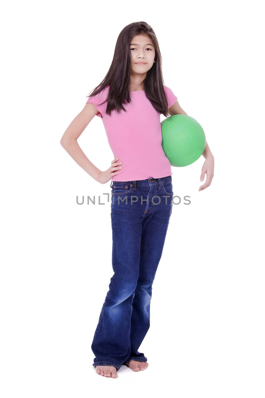 Ten year old Asian girl holding green ball with challenging stance, isolated on white