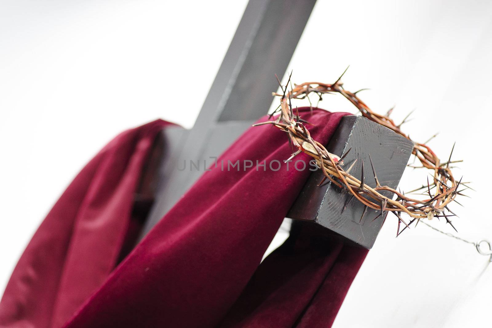 Crown of thorns hung around the Easter cross