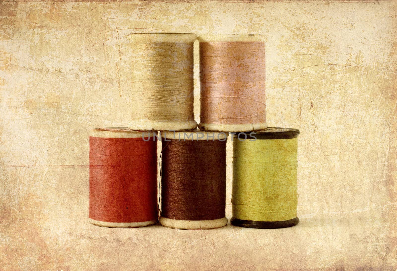 Different colors of thread spools, photo in old image style