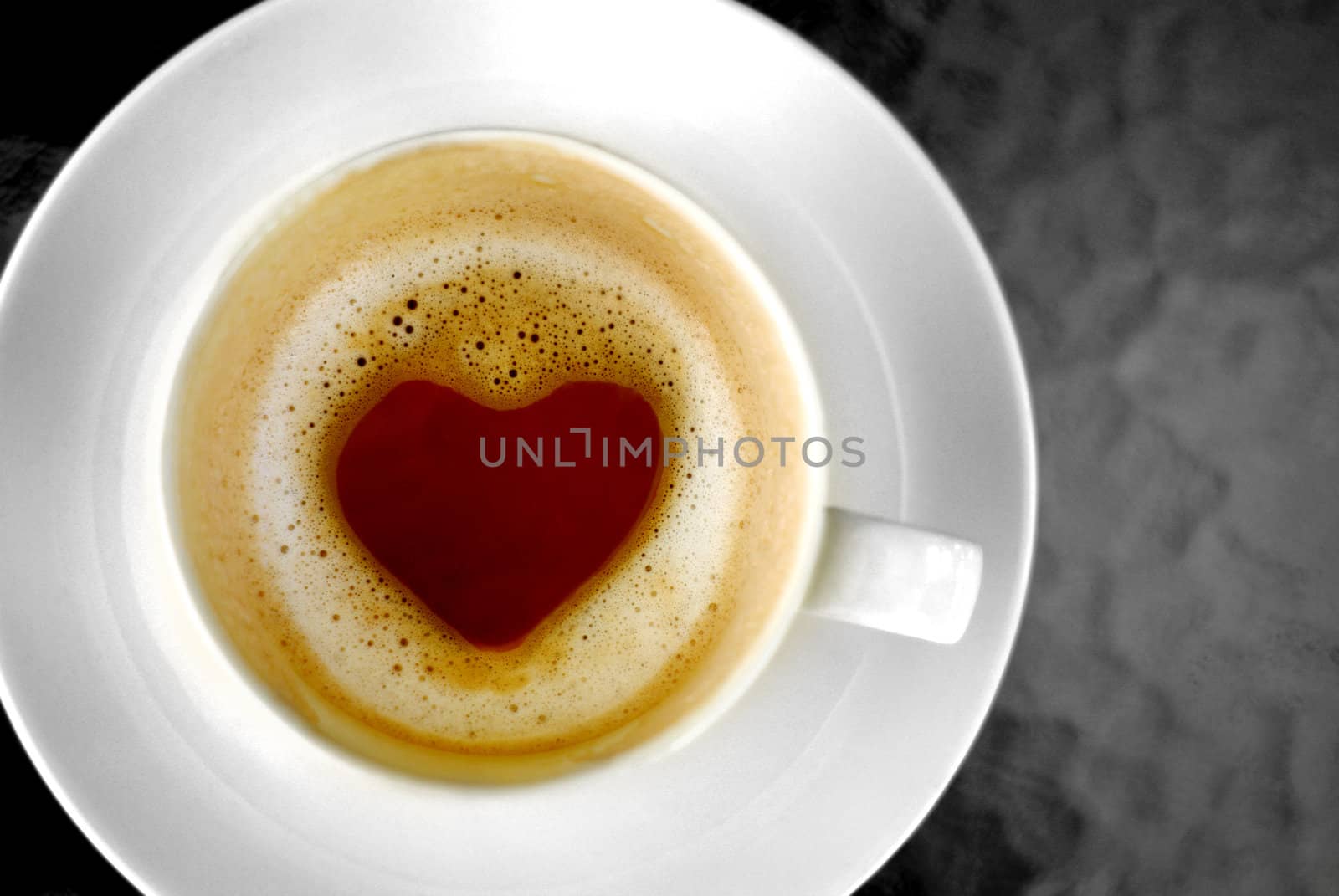 Heart shape inside hot coffee cup