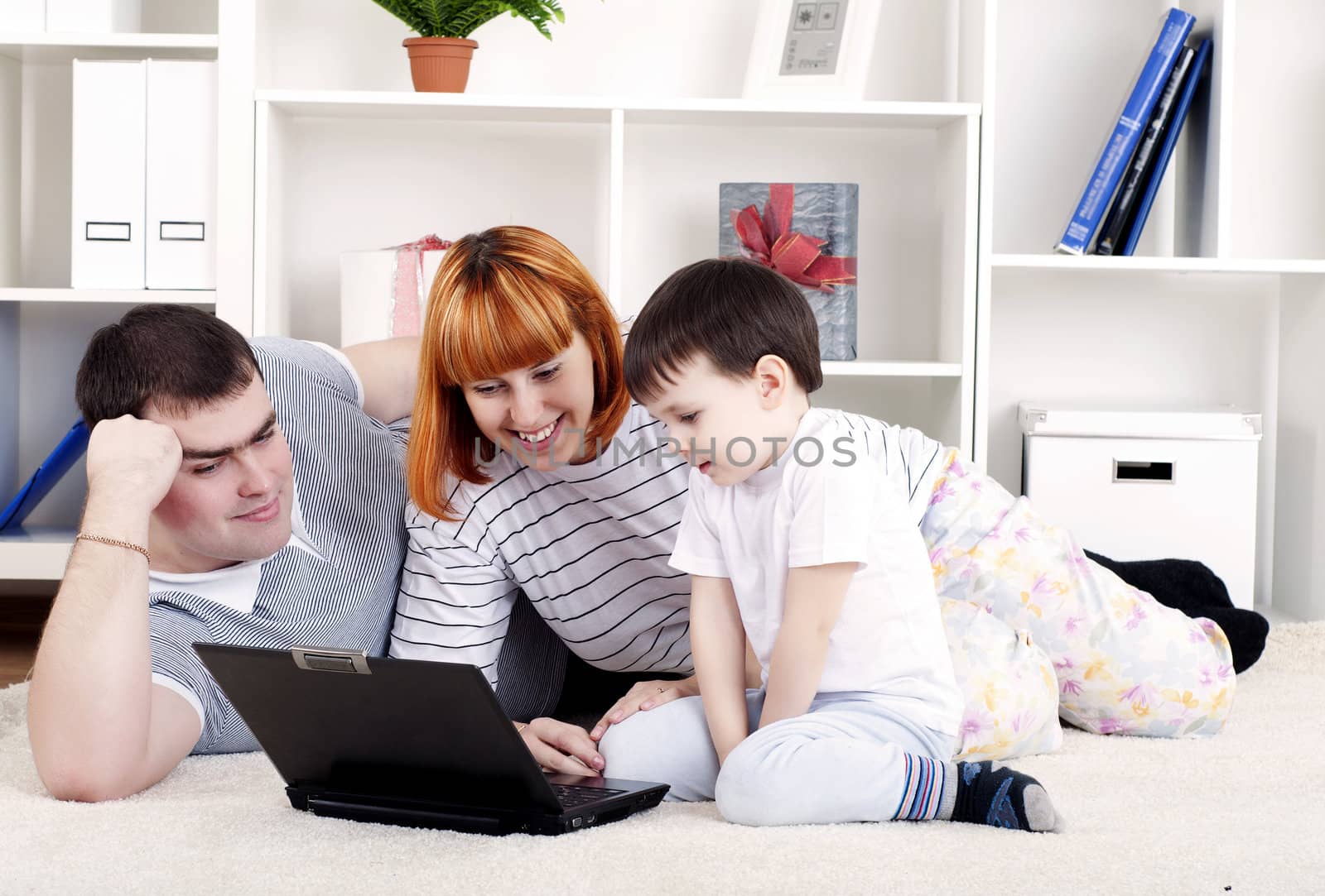 Family looking at a laptop, a rest home
