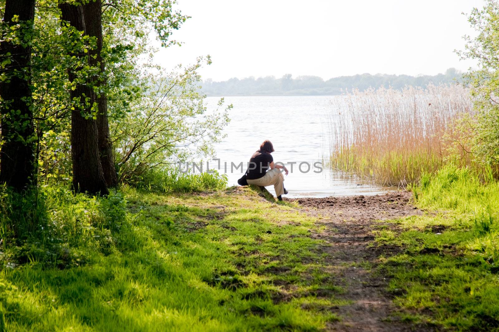 relaxed woman at a lake