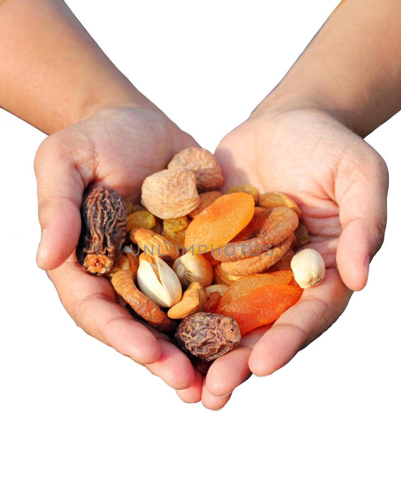 Woman holding bunch of dry fruits like almonds, raisins, dates and apricots isolated on white