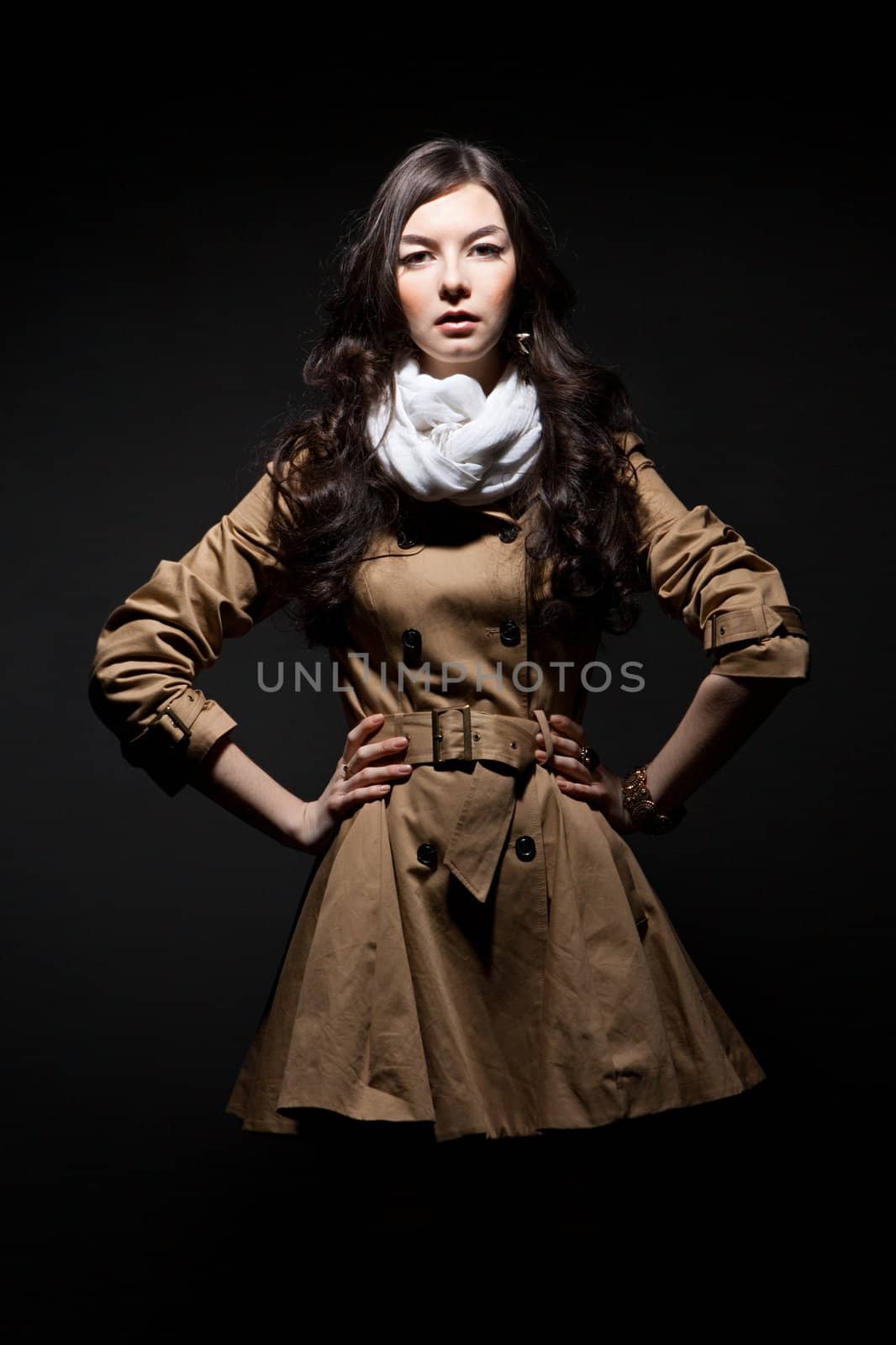 The portrait of sensual young woman on dark background