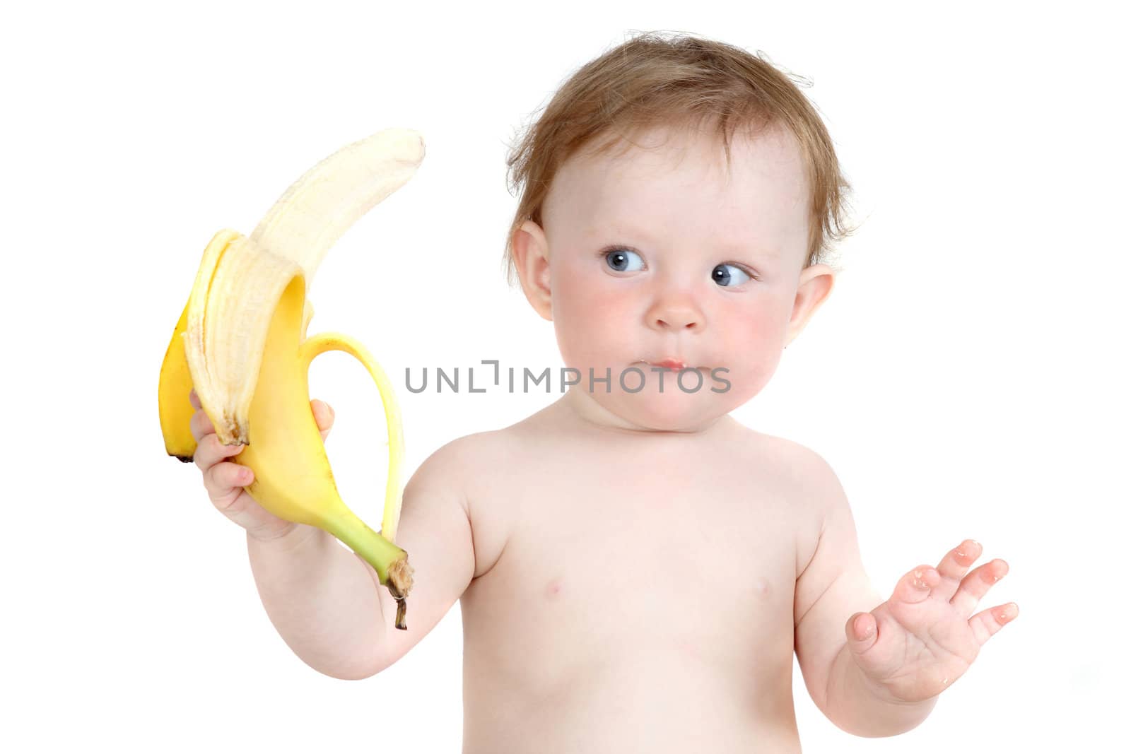 the little blue-eyed girl eats banana. a portrait on a white background. option 2