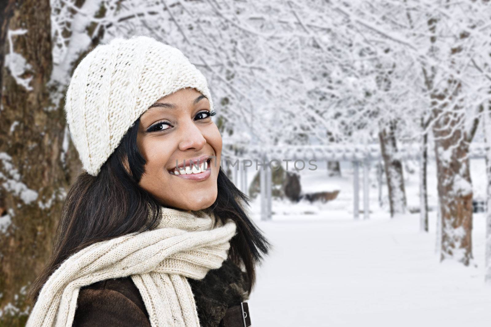 Portrait of happy woman outdoors in winter