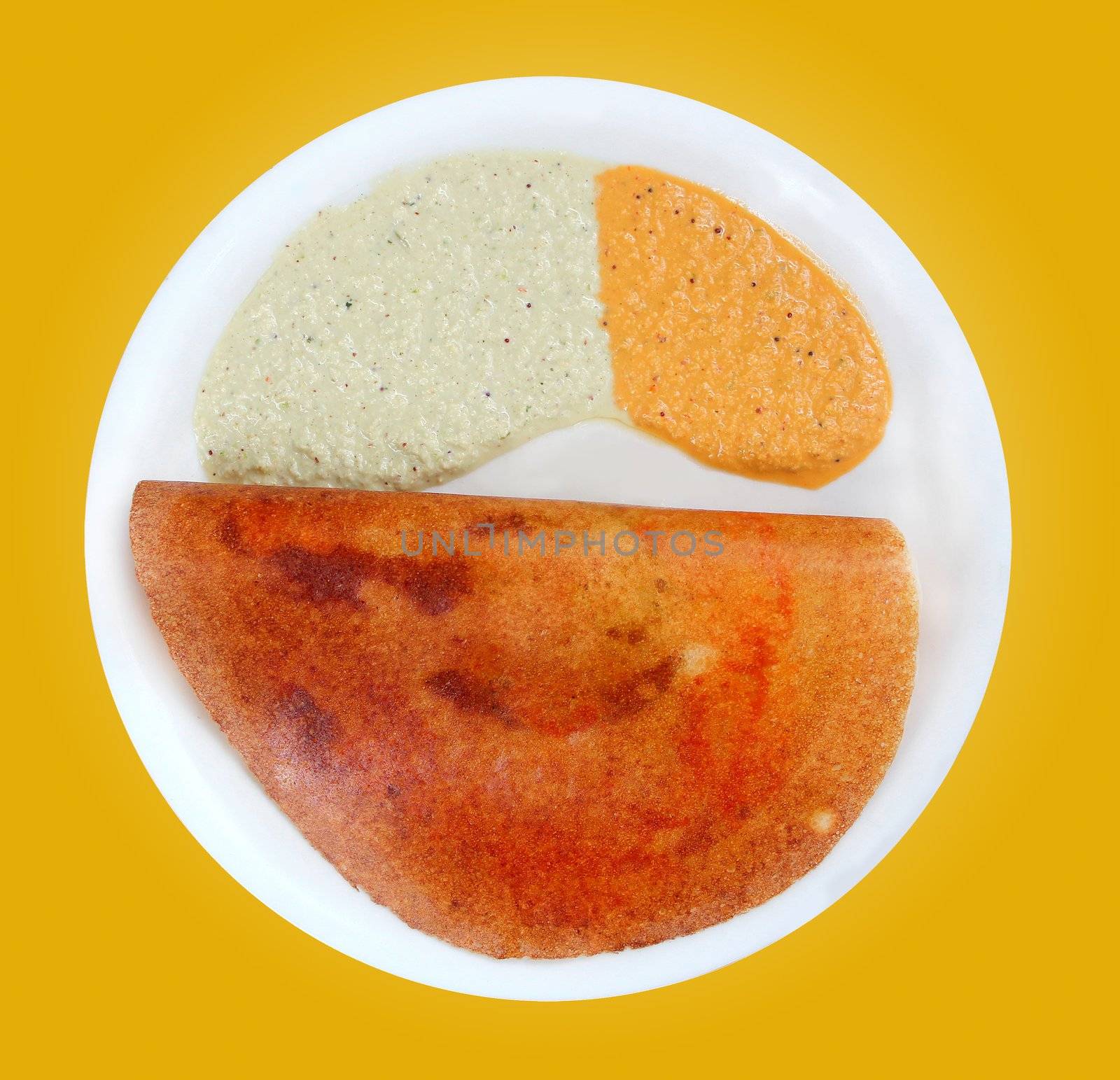 Masala dosa with different types of chutney on a plate with clipping mask for easy isolation