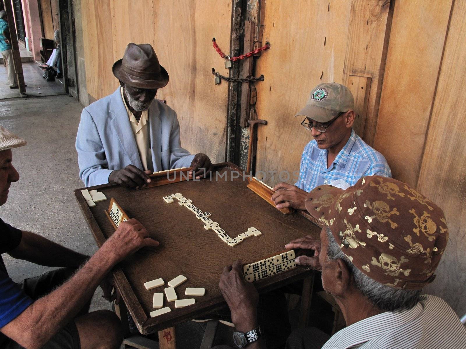 La Havana, Cuba- February 2, 2009: Elderly Cubans spend their time playing in the streets of Havana.