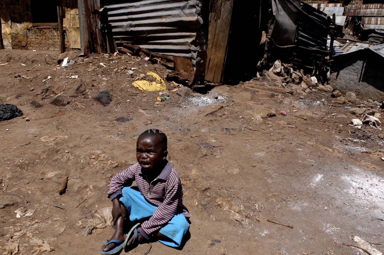 Nairobi, Kenya-January 27, 2004:children living in Kibera.Is the largest slum in Africa in the center of Nairobi.There are no toilets,the sewers are open.There are many orphans, and HIV disease,malaria