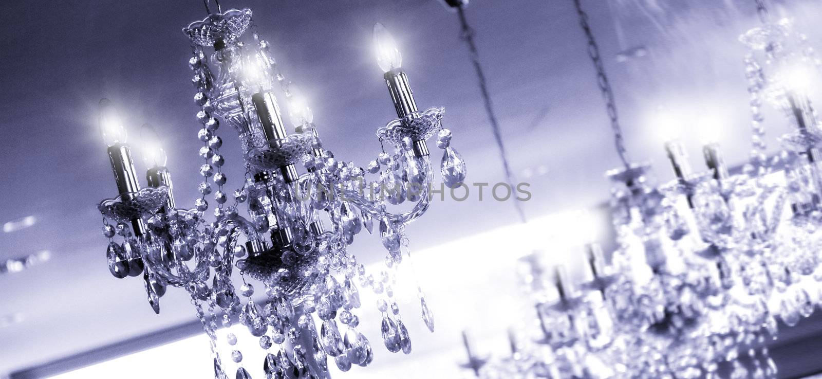 any chandeliers on the ceiling of a luxury room