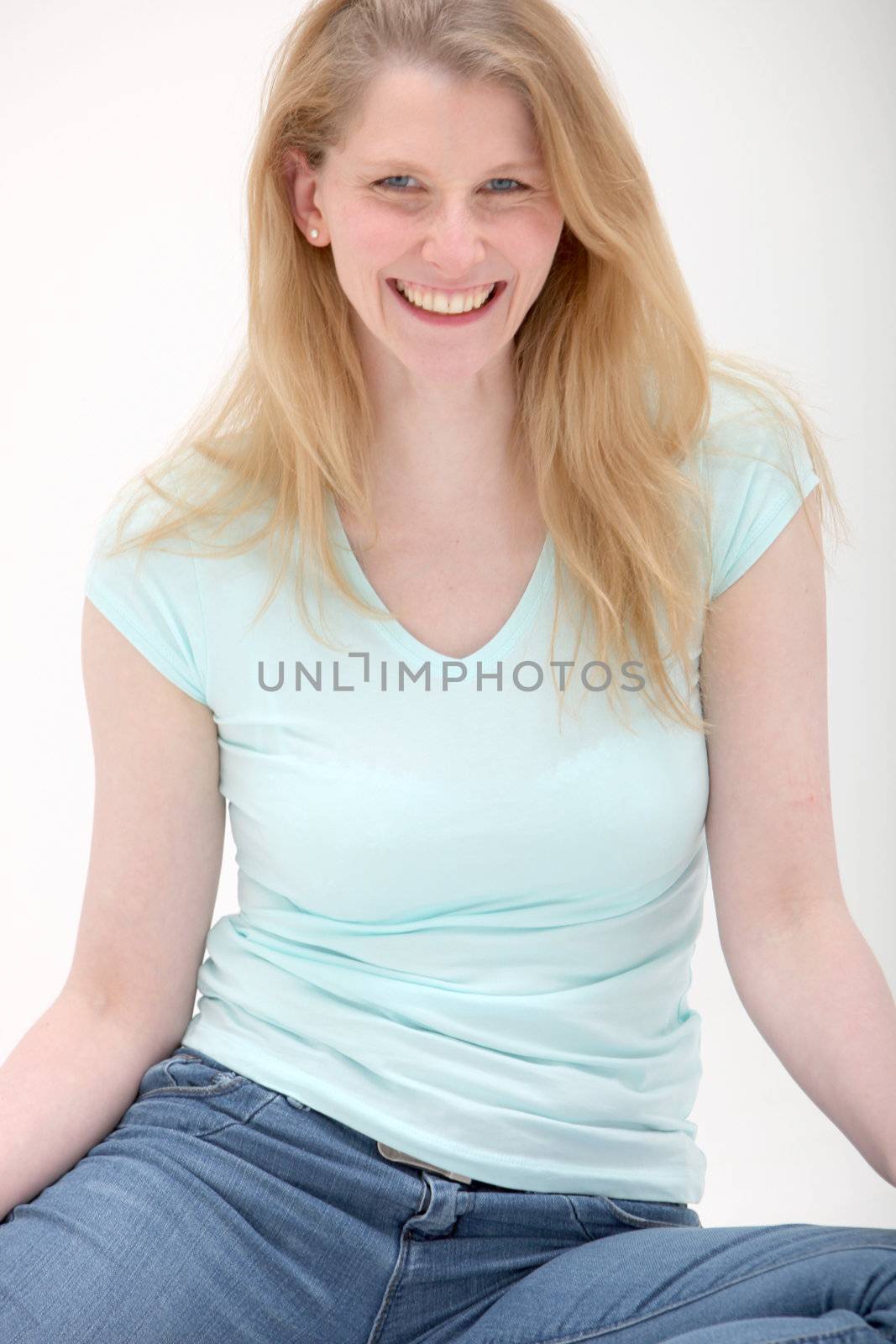 Studio shot of smiling young woman on white background