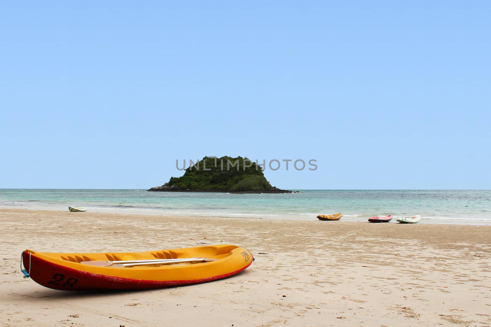 Kayaks on the tropical beach by bajita111122