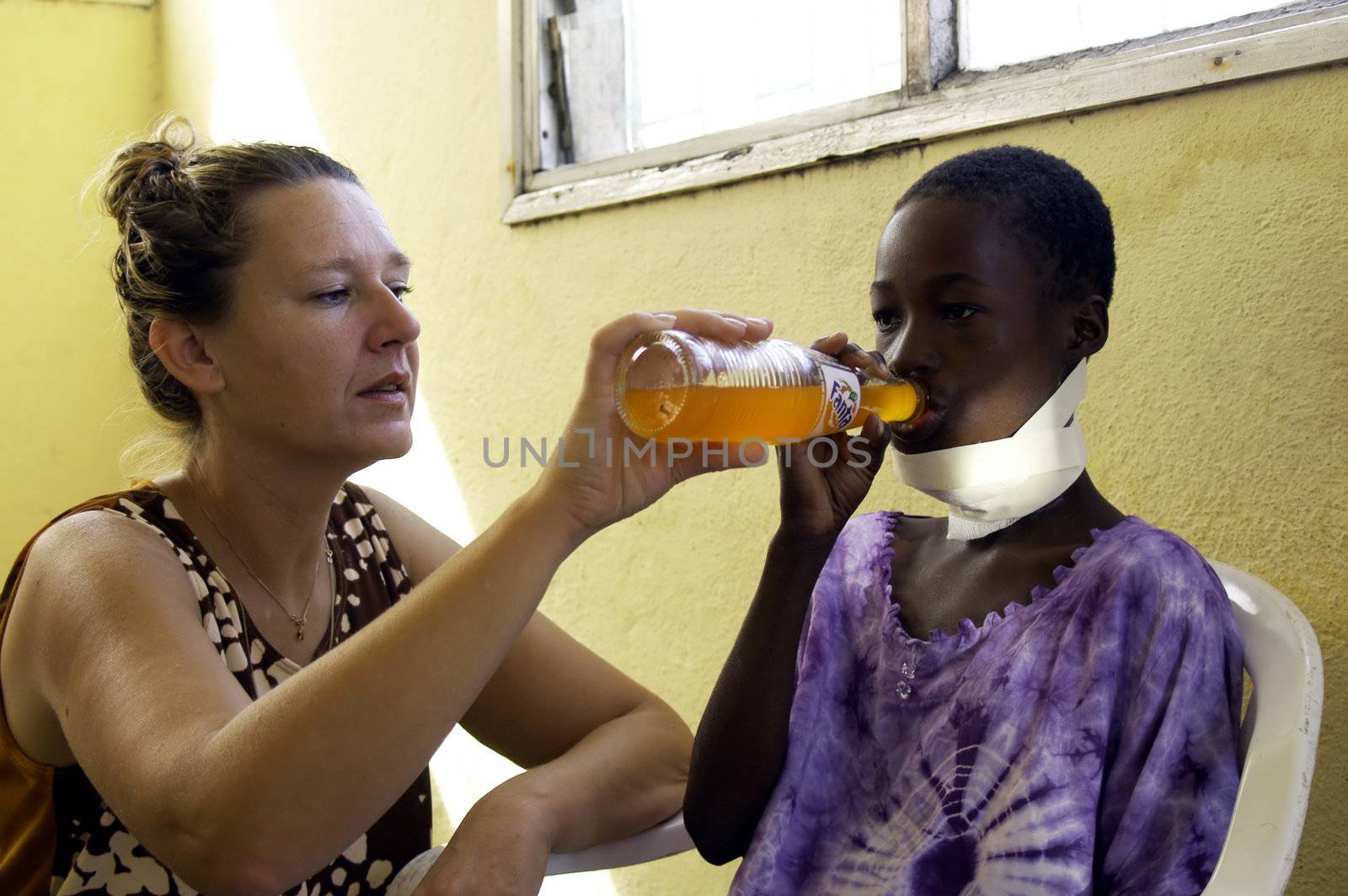 Beira, Mozambique -January 10,2010:Swiss woman,Barbara Hofmann,helps a child made.Since 1989 after seeing the reality of war,has opened a center in its structure and collects child war victims,orphans and abandoned giving them the education