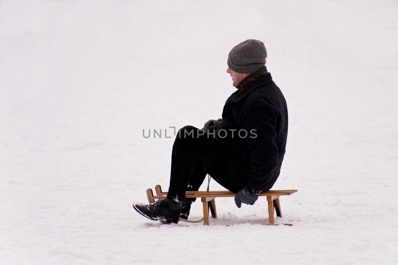 sledding in a snow covered landscape