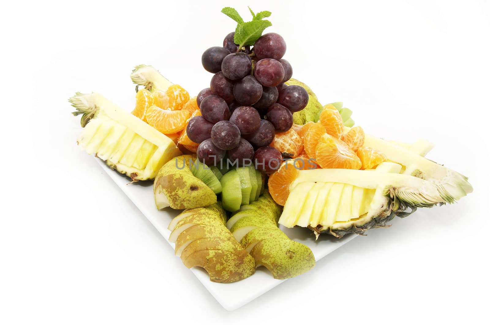 plate of sliced fruit in a nice restaurant on a white background