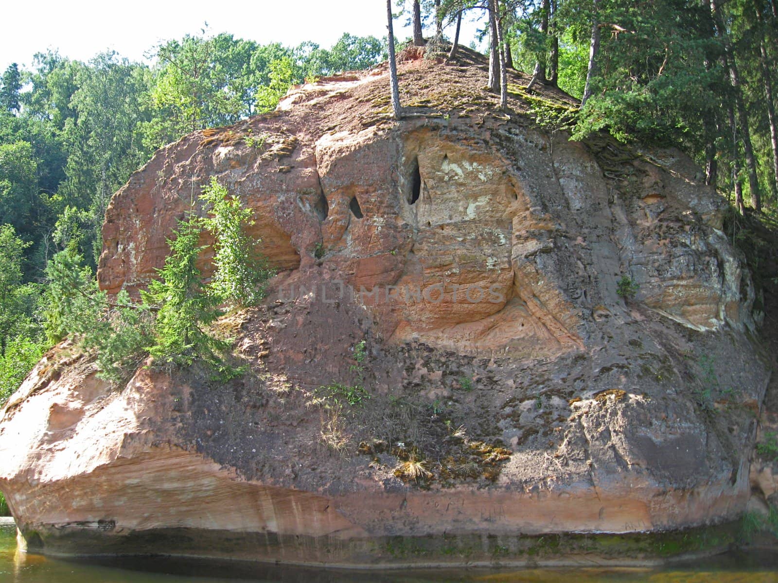 Zvārta Rock is one of the most spectacular outcrops of Devon rock formations in Latvia, set in the territory of the Gauja National Park. The Zvārta Rock has been formed by the River Amata gnawing at the sandstone on its banks.