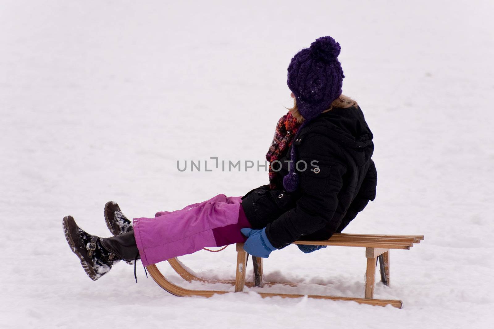 sledding in a snow covered landscape