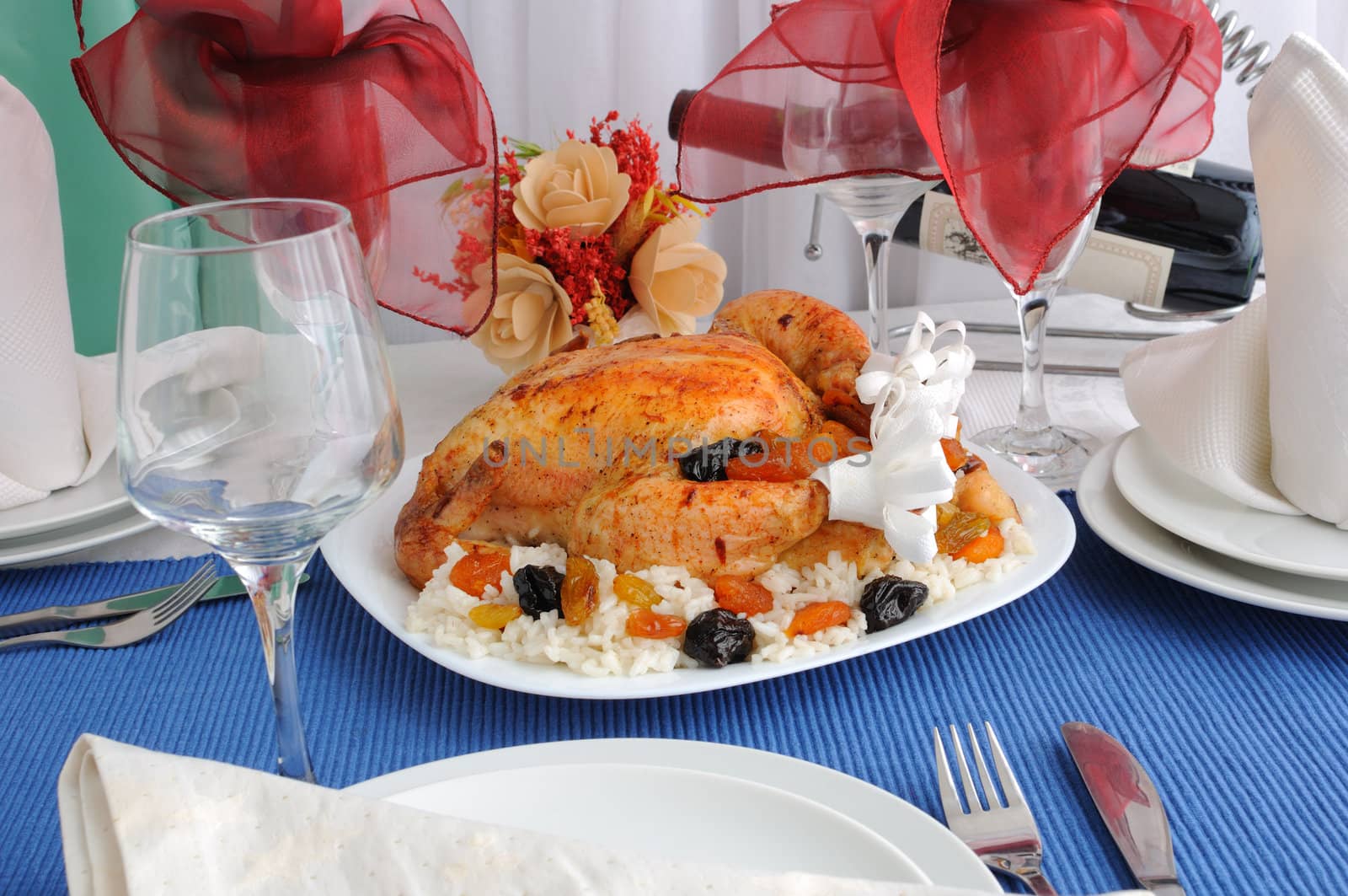 Grilled Chicken with rice and dried fruit on the dining table