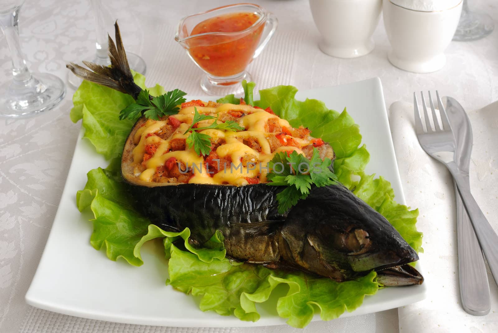 The fish (mackerel), stuffed with vegetables and cheese