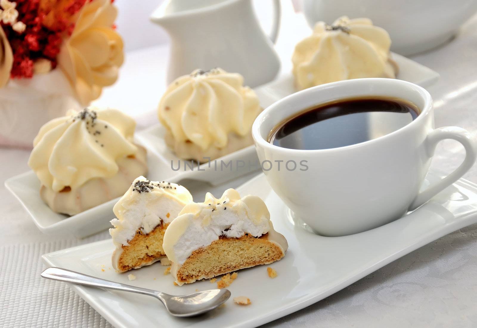 Cookies with zefirnoy filling in milk glaze with a cup of coffee
