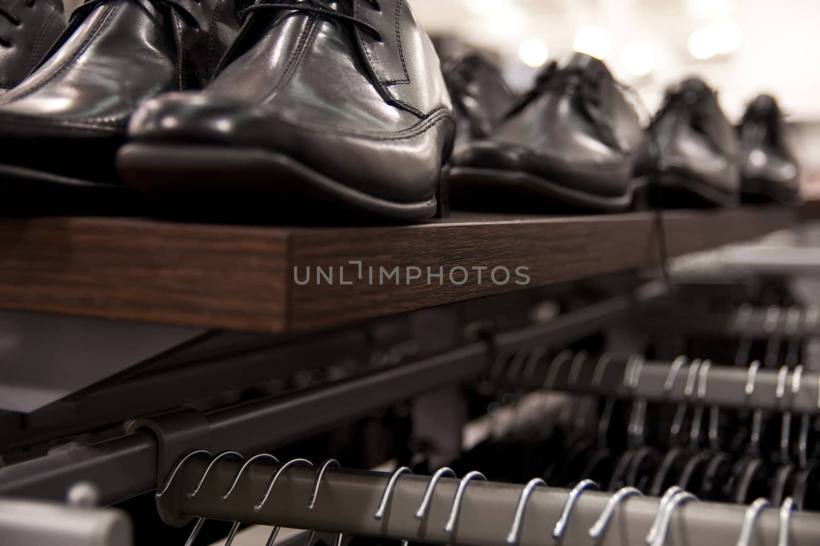 Close-up on shelf with mens, elegant shoes. Shallow depth of field.