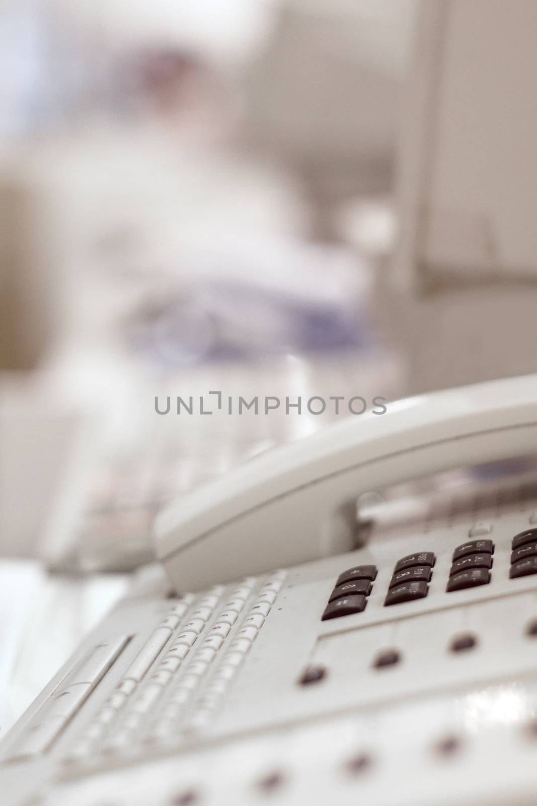 Close-up on phone beside computer on the business desk