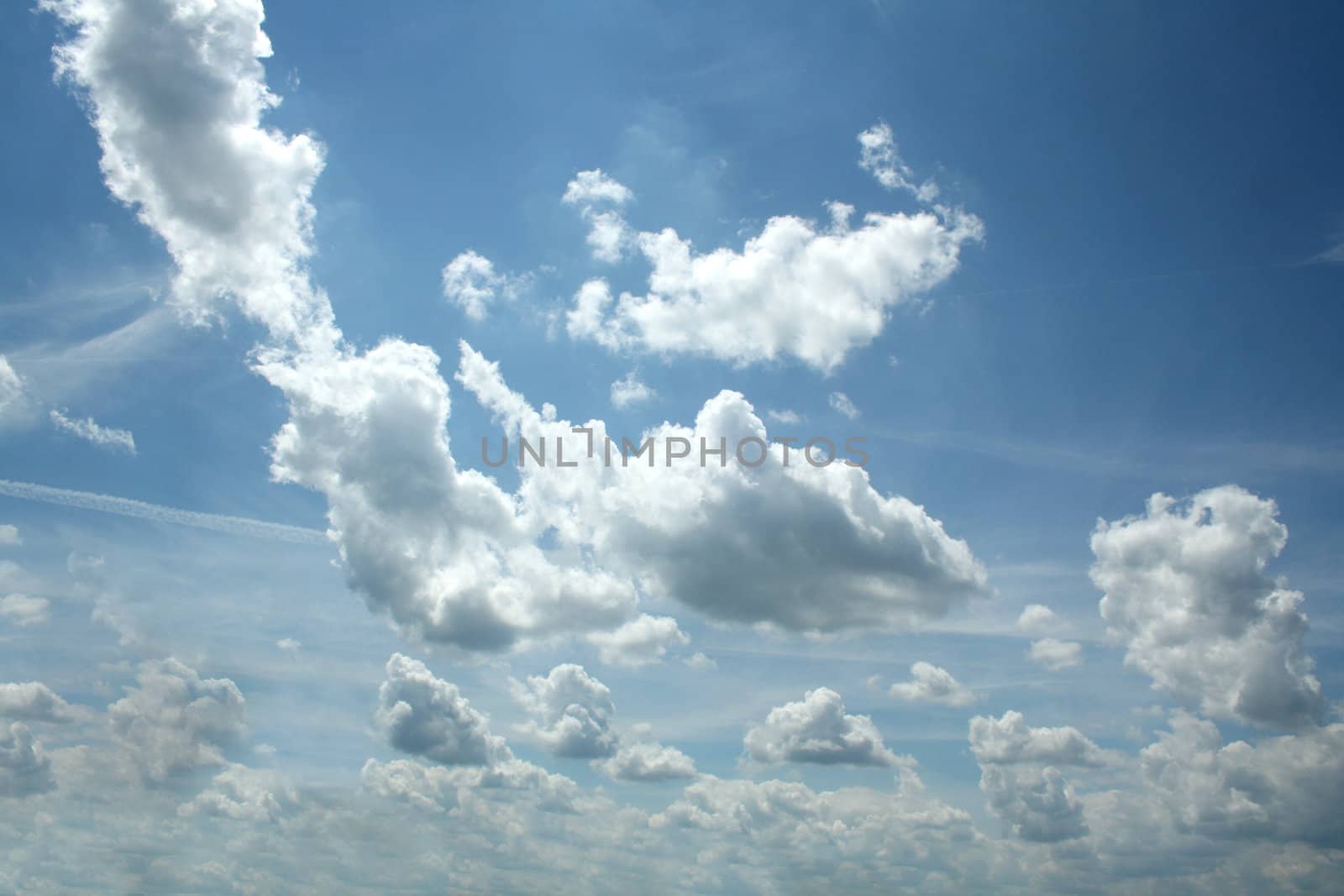 many clouds on blue sky by photochecker
