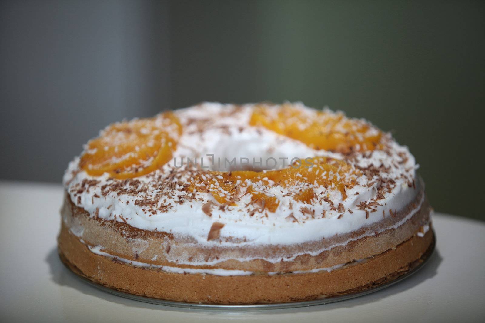 sponge cake with apricot cream and grated chocolate