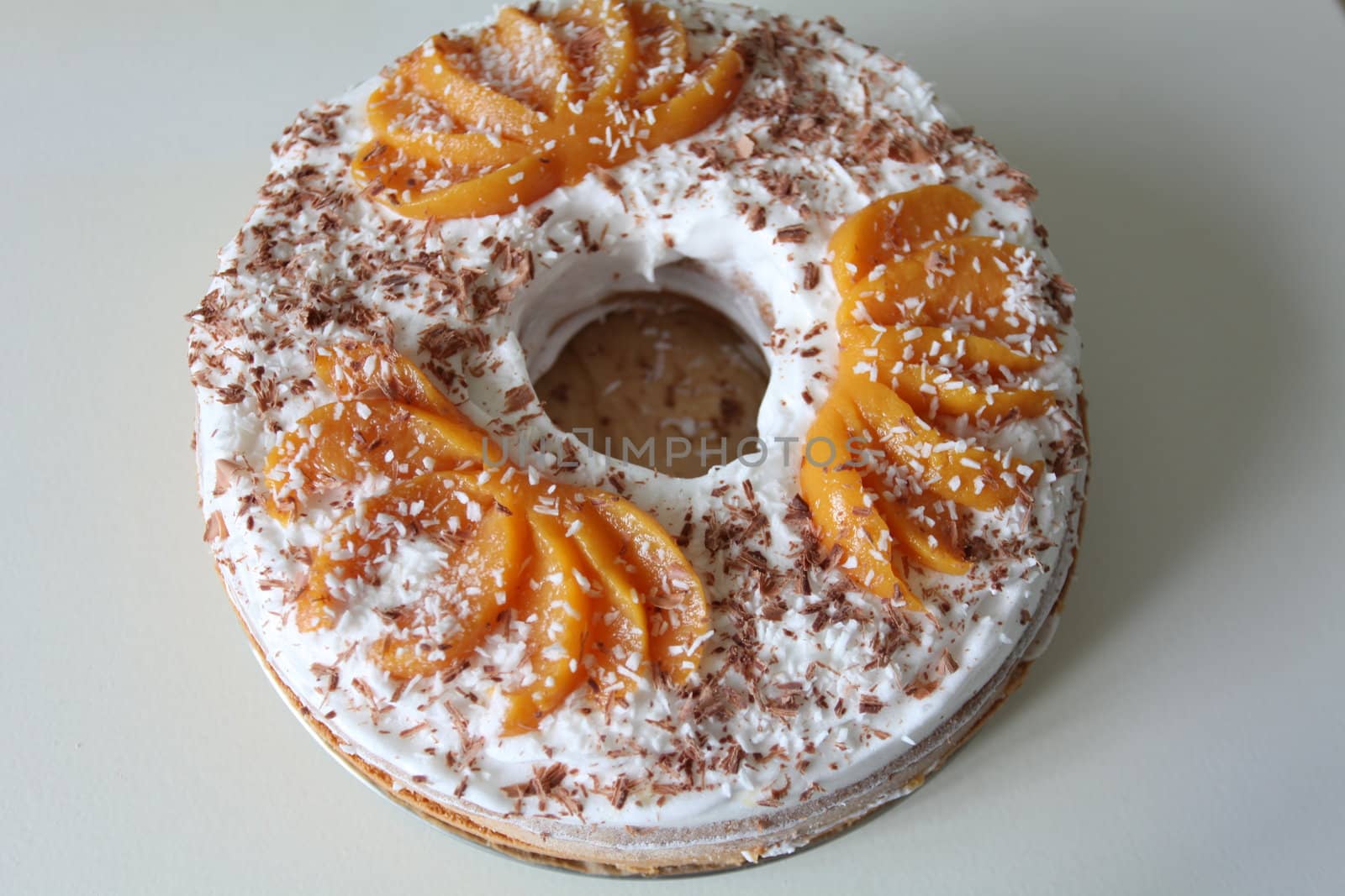 sponge cake with apricot cream and grated chocolate