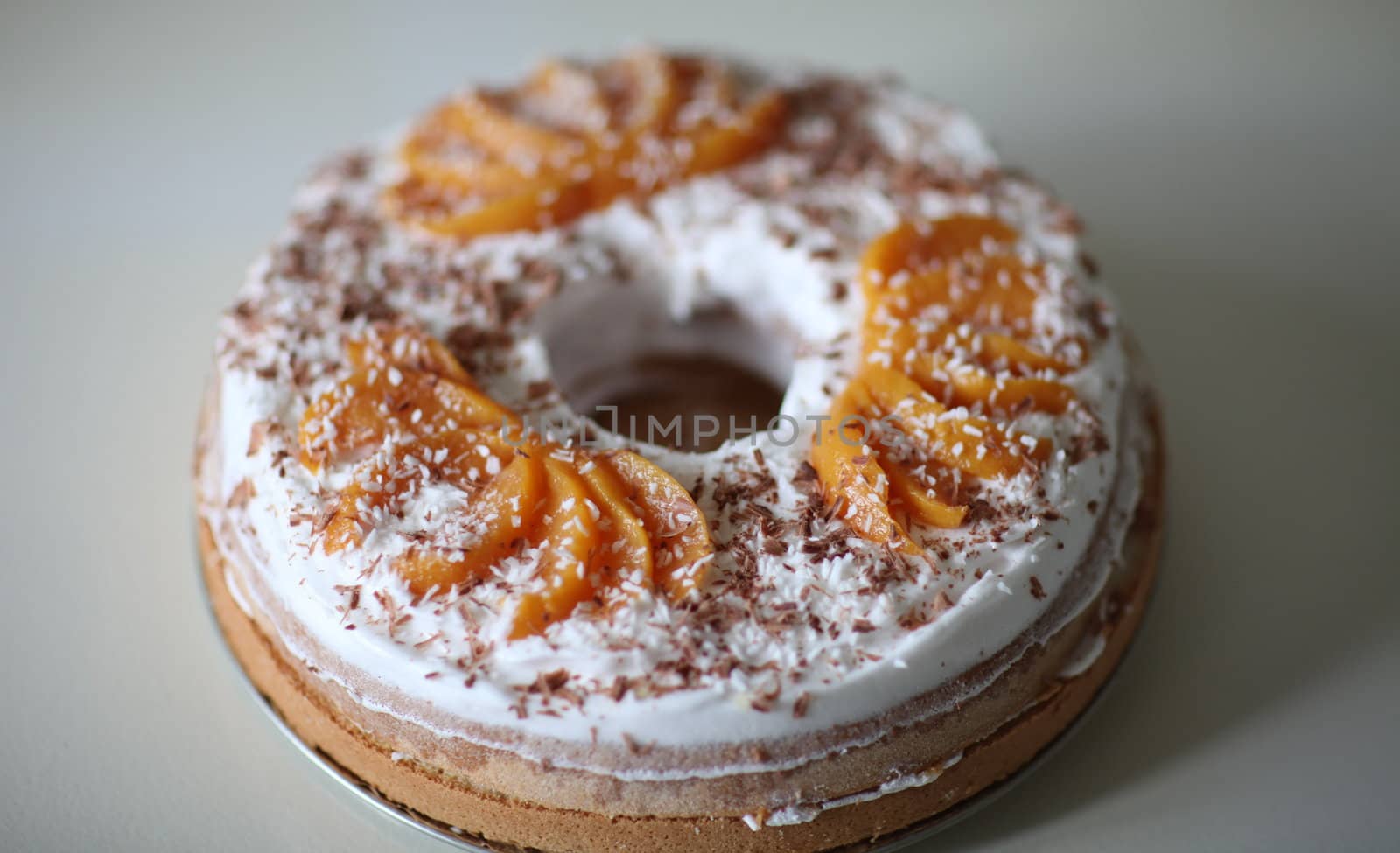 sponge cake with apricot cream and grated chocolate